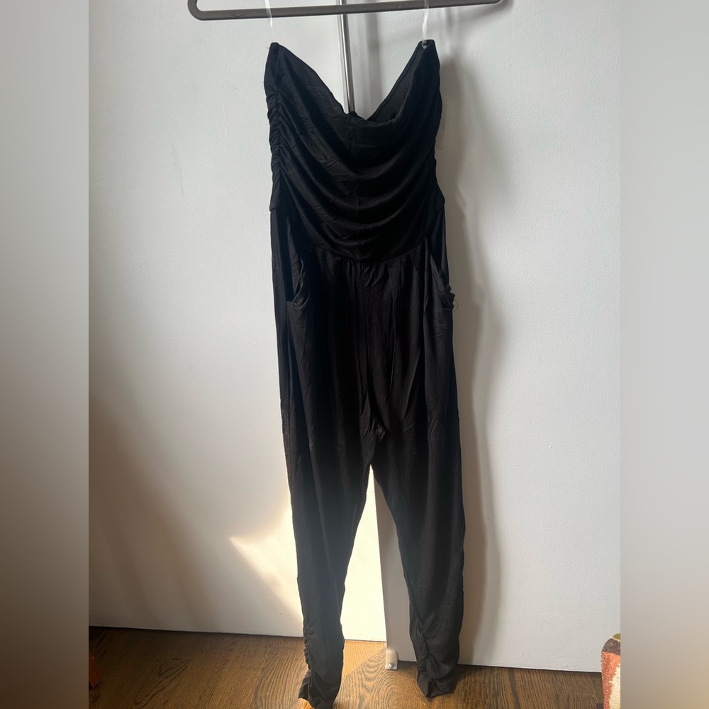 Black jumpsuit. Rayon. Large (runs small) pockets. Strapless.